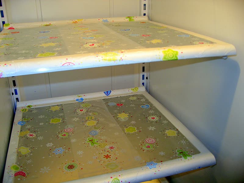 Line your shelves with plastic wrap