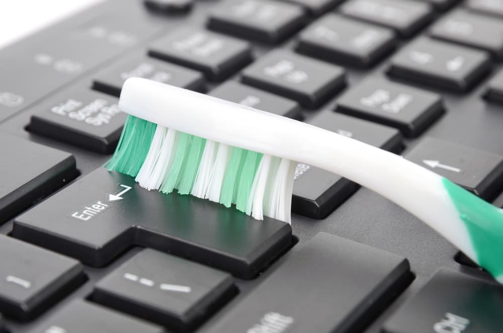 Clean Your Keyboard With A Toothbrush